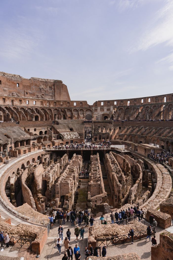 A breathtaking aerial shot of the Colosseum's interior architecture in Rome, Italy.